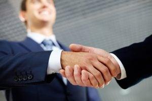 Men shaking hands in a suit